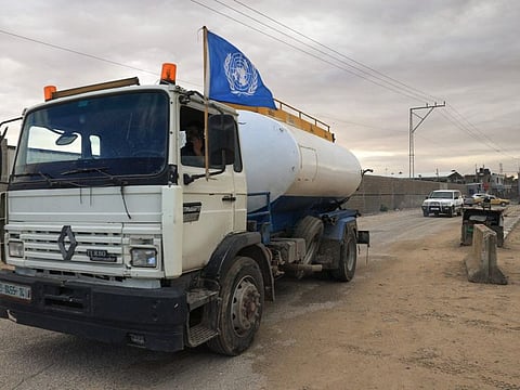 A truck carrying fuel with a UN flag crosses into Rafah in the southern Gaza Strip on November 15, 2023, amid the ongoing battles between Israel and the militant group Hamas.