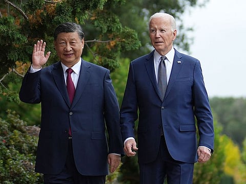 President Joe Biden and China's President President Xi Jinping walk in the gardens at the Filoli Estate in Woodside, California.