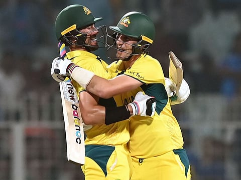 Australian skipper Pat Cummins and Mitchell Starc celebrate after beating South Africa by three wickets in the World Cup semi-finals in Kolkata on Thursday.