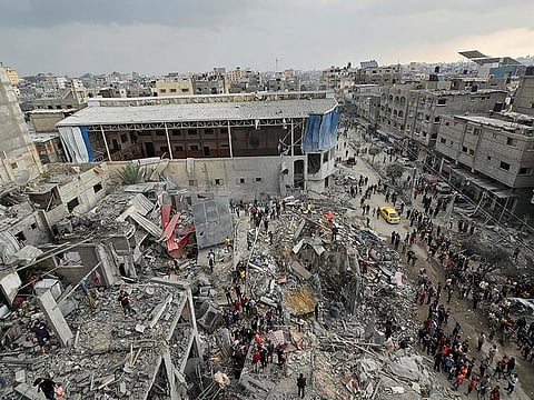 File photo: Palestinians inspect the site of Israeli strikes on houses in Jabalia refugee camp, in northern Gaza, on November 14, 2023. 