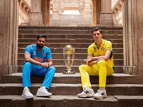Indian skipper Rohit Sharma and his Australian counterpart Pat Cummins with the ICC 50-over World Cup trophy at Adalaj Stepwell in Gujarat.
