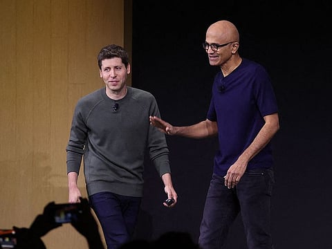 File photo: Microsoft CEO Satya Nadella (right) greets OpenAI CEO Sam Altman during the OpenAI DevDay event on November 06, 2023 in San Francisco, California. 