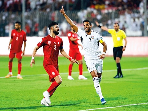 UAE’s Ali Mabkhout celebrates scoring their second goal against Bahrain during the World Cup qualifiers Group H match at Bahrain National Stadium yesterday.