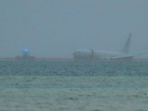 A downed US Navy aircraft is seen in Kaneohe Bay, Monday, Nov. 20, 2023, in Kaneohe, Hawaii.