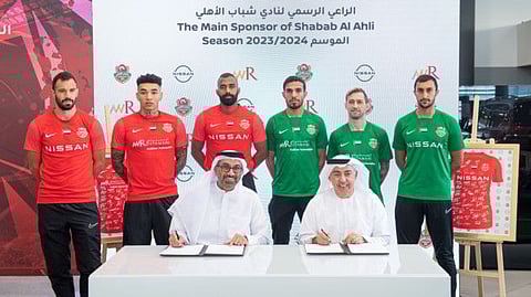 The signing ceremony was held under the victorious slogan 'We are the champions.'