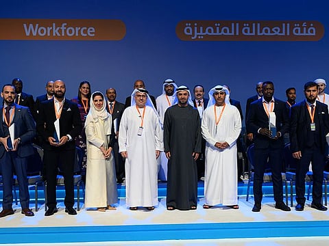 Labour Market Awards winners with Sheikh Mohammed bin Hamad bin Tahnoun Al Nahyan, Advisor for Special Affairs at the Ministry of Presidential Court, and Dr Abdulrahman Al Awar, Minister of Human Resources and Emiratisation, at the Abu Dhabi National Exhibition Centre  on Thursday