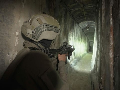 Israeli soldiers show the media a tunnel found underneath Al Shifa Hospital in Gaza City.