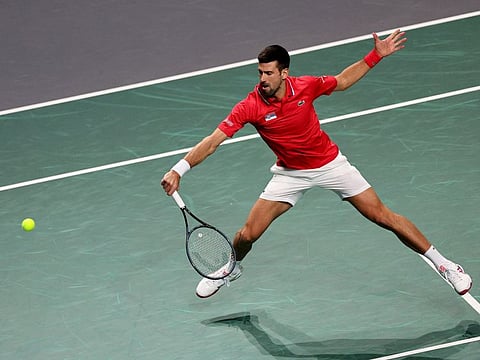 Serbia's Novak Djokovic in action against Italy's Jannik Sinner during the Davis Cup semi-finals in Malaga.