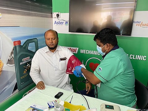 Auto mechanics received a wellness card comes with free medical checks and discounted rates on prescribed medicines from Aster Hospitals, valid across their network for a year in UAE and India.