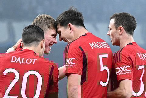 Manchester United's Danish strikerRasmus Hojlund (2nd from left) celebrates with teammates after scoring the 0-1 against FC Copenhagen. 