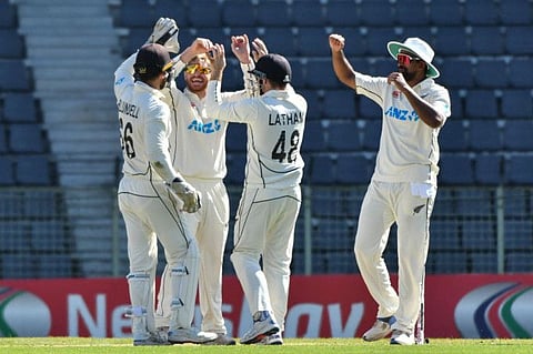 New Zealands cricketers celebrate the dismissal of Bangladeshs Najmul Hossain Shanto during the first day of the first Test at the Sylhet International Cricket Stadium on Tuesday.