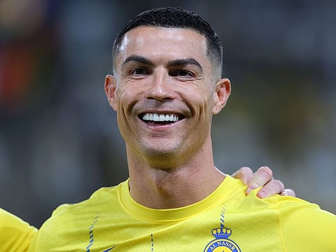 Nassr's Portuguese forward #07 Cristiano Ronaldo smiles during the AFC Champions League Group E football match between Saudi's al-Nassr and Iran’s Persepolis at the Al-Awwal Stadium in Riyadh on November 27, 2023.