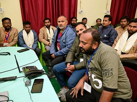 Workers rescued from the Silkyara tunnel speak to Prime Minister Narendra Modi over the phone, on Tuesday, November 28, 2023.