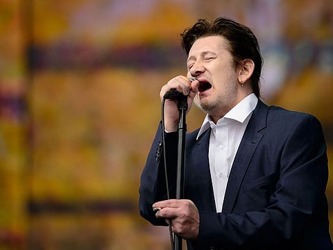 Shane MacGowan of British group The Pogues performs on stage at the British Summer Time festival in Hyde Park in central London, on July 5, 2014.