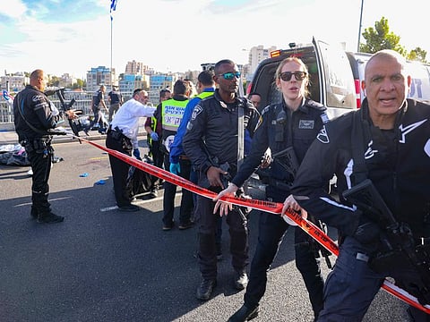 Israeli police secure the scene of a shooting in Jerusalem near the Jewish settlement of Ramot on November 30, 2023.  