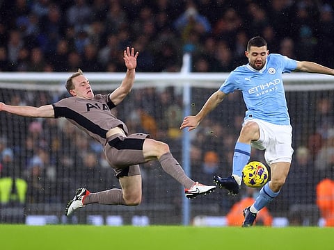 Tottenham Hotspur's Oliver Skipp battles with Manchester City's Mateo Kovacic during a Premier League match at Etihad Stadium on Sunday.