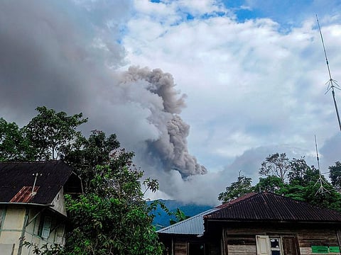 Mount Merapi volcano spews volcanic ash as seen from Nagari Sungai Pua, in Agam, West Sumatra province, Indonesia