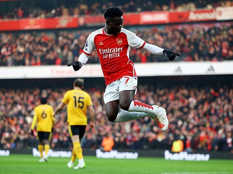 Arsenal's Bukayo Saka celebrates scoring their first goal during a Premier League against Wolverhampton Wanderers at the Emirates Stadium, London, on December 2.
