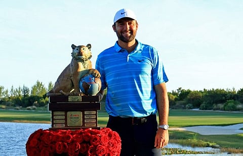 Scottie Scheffler of the US with the trophy after winning the Hero World Challenge at Albany Golf Course on Sunday.