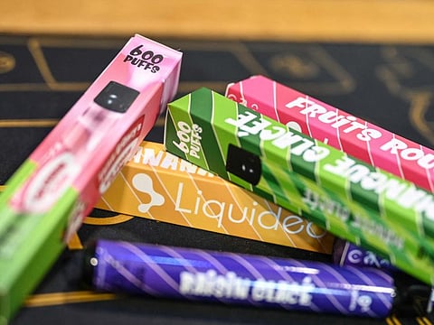 This photograph shows boxes of "puffs" disposable electronic cigarettes displayed on table at La Vapotitheque store in Bethune, northern France, on May 25, 2022.