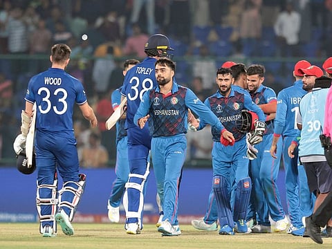 Players shakes hand after the Afghanistan defeated England during the World Cup 2023 in New Delhi.