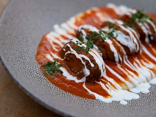 Authentic Greek Soutzoukakia recipe: Perfectly spiced meatballs in tomato sauce