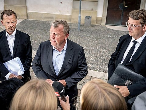 Denmark's Minister of Foreign Affairs Lars Loekke Rasmussen, centre, Minister of Justice Peter Hummelgaard, left and acting Minister of Defense Troels Lund Poulsen address the media after a briefing by members of the Danish Parliament on the international reactions to the Quran burnings, in Copenhagen, Monday, July 31, 2023. 