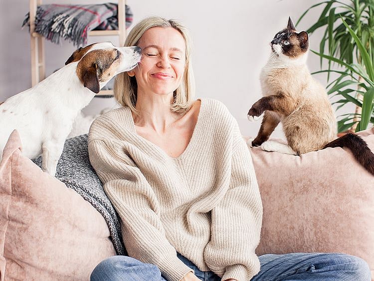 Woman with dog and cat