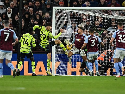 Arsenal's midfielder Kai Havertz (left) and Aston Villa's defender Matty Cash fight for the ball during a English Premier League match between Aston Villa and Arsenal at Villa Park in Birmingham.