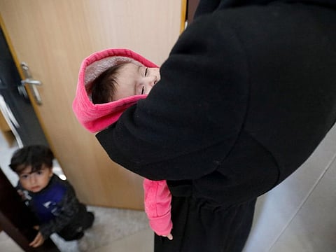 Palestinian children wait to get examined by a doctor, amid a warning by World Health Organisation of a surge in infectious diseases and diarrhoea in children, at a healthcare centre in Khan Younis. 