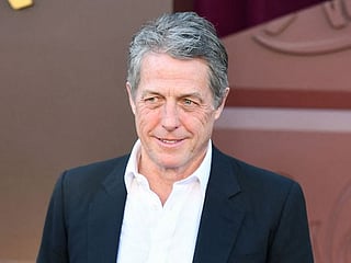 Hugh Grant jokingly blames kids for making his life joyless
