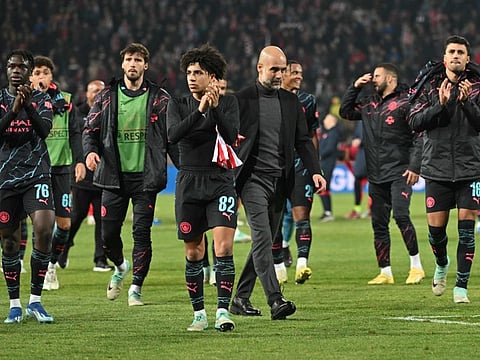 Manchester City's Spanish manager Pep Guardiola (centre right) and players celebrate after winning the Uefa Champions League Group G match against Red Star Belgrade at the Red Star stadium in Belgrade on Wednesday.