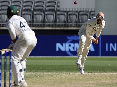 Australia's Nathan Lyon bowls to Pakistan's Faheem Ashraf during the first Test against Pakistan in Perth on Sunday.