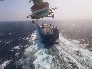 A Houthi military helicopter flies over the Galaxy Leader cargo ship in the Red Sea in November 2023. Houthi attacks on commercial shipping previously disrupted traffic through the Bab Al Mandab Strait, one of the world's most important maritime chokepoints.