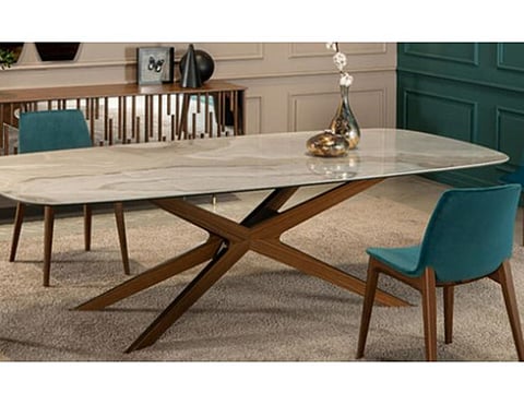 Blade, designed by Tonin Casa, stands out as an elegant dining table featuring an architectural base. The base, available in a variety of lacquered steel or wooden colors, elevating this table to become the focal point of any dining area.