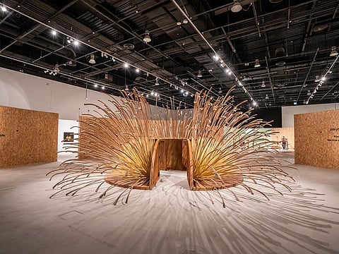 The exhibition "Rooted: Sustainability - an Art Perspective", includes “Dome Path,” by Emirati artist Azza Al Qubaisi, inspired by palm tree branches and integrated with stainless steel, which reflects a deep connection to the UAE’s past.