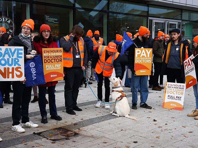 Junior doctors strike on a picket line outside the Queen Elizabeth Hospital in Birmingham on December 20, 2023.  
