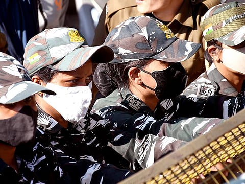 Women security personnel with face masks after cases of COVID-19 sub-variant JN.1 were detected in the country, in Guwahati.   