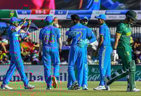 Indian players celebrate the dismissal of South Africa's Reeza Hendricks during the third ODI match at Boland Park in Paarl on December 21.