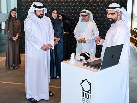 (left) Sheikh Ahmed bin Mohammed bin Rashid Al Maktoum, Second Deputy Ruler of Dubai and Chairman of the Dubai Media Council, being briefed on the sidelines of the Dubai Media Council meeting on Tuesday