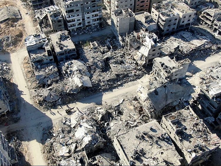  An aerial view on December 26, 2023 shows destroyed buildings in Beit Lahia following Israeli bombardments in the northern Gaza Strip.