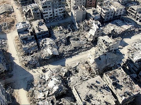  An aerial view on December 26, 2023 shows destroyed buildings in Beit Lahia following Israeli bombardments in the northern Gaza Strip.