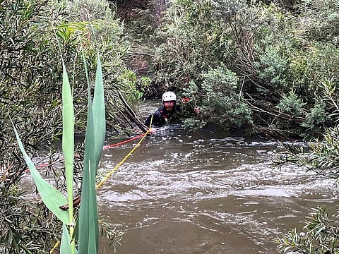 An emergency worker during a rescue operation in the midst of flood waters after heavy rain at the Buchan campground in east Gippsland, located east of Melbourne in the Australian state of Victoria. 