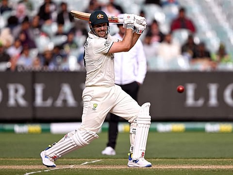 Australian batsman Mitch Marsh hits a cover drive on the third day of the second cricket Test match against Pakistan at the Melbourne Cricket Ground (MCG) on Thursday.