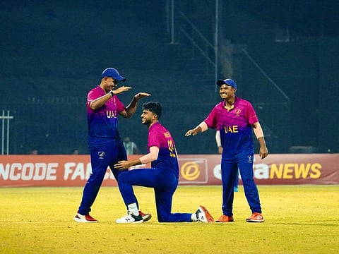 UAE all-rounder Ali Naseer celebrates with Aryan Lakra and Aayan Afzal Khan during the second Twenty20 against Afghanistan on Sunday.