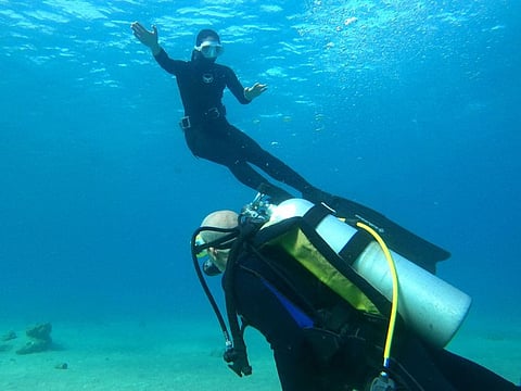 Yamit Avital and her husband Benny, who are among the survivors from Kibbutz Nir Oz, taking part in a free diving session offered to evacuated Israelis and survivors of the October 7 Hamas attacks, off the coast of Israel's southern Red Sea resort city of Eilat.  