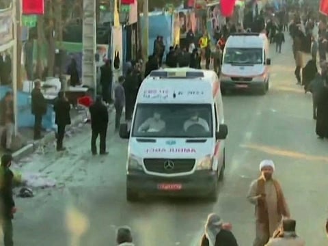 An image grab from a video released by state-run Iran Press news agency on January 3, 2024 shows ambulances leaving the site where two explosions in quick succession struck a crowd marking the anniversary of the 2020 killing of Guards general Qasem Soleimani, near the Saheb Al Zaman Mosque in the southern Iranian city of Kerman.  