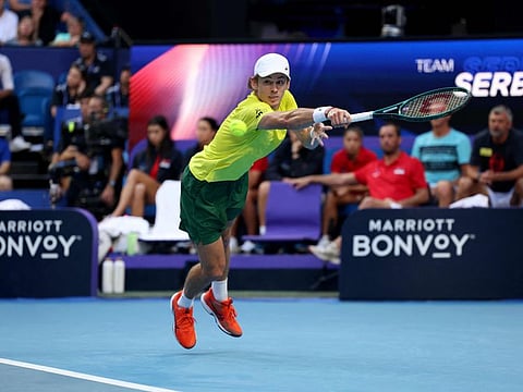 Australia's Alex de Minaur hits a return against Serbia's Novak Djokovic during their men's singles match at the United Cup tournament in Perth on Wednesday.