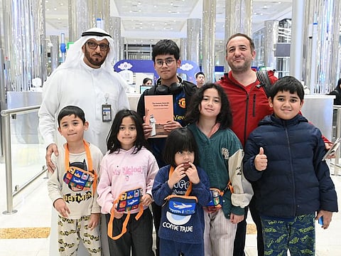 Lieutenant General Mohammed Ahmed Al Marri, Director General of GDRFA Dubai with some children in Dubai who were gifted copies of 'From the Desert to Space' a book written by His Highness Sheikh Mohammed bin Rashid Al Maktoum, Vice President and Prime Minister of the UAE and Ruler of Dubai