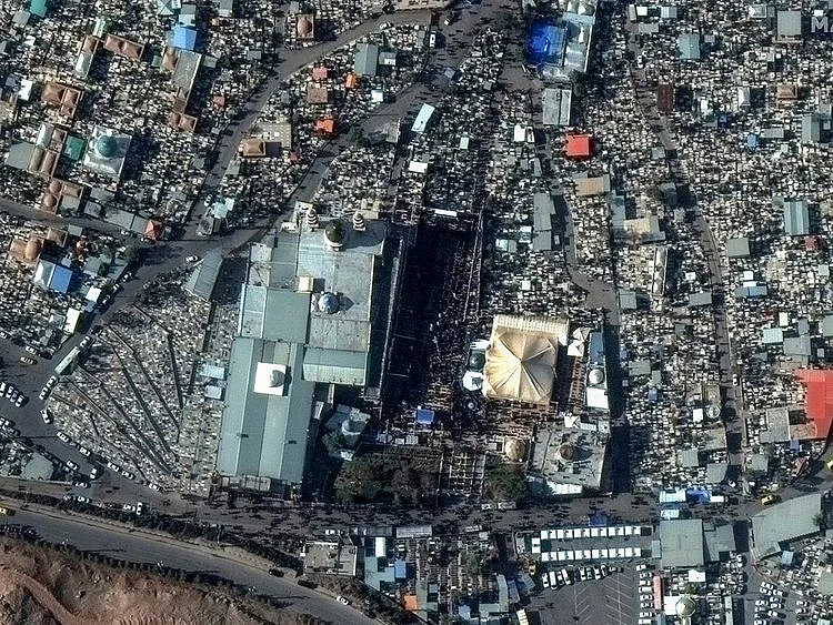 This image, provided by Maxar Technologies, shows a closer view of people gahter at the General Qassem Soleimani shrine at the martyr's cemetery in Kerman, Iran, on January 3, 2024 before the twin bomb blasts killed at least 103 people at an event honoring a prominent Iranian general slain in a US airstrike in 2020. 